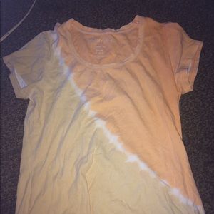 a orange and yellow tie dye shirt